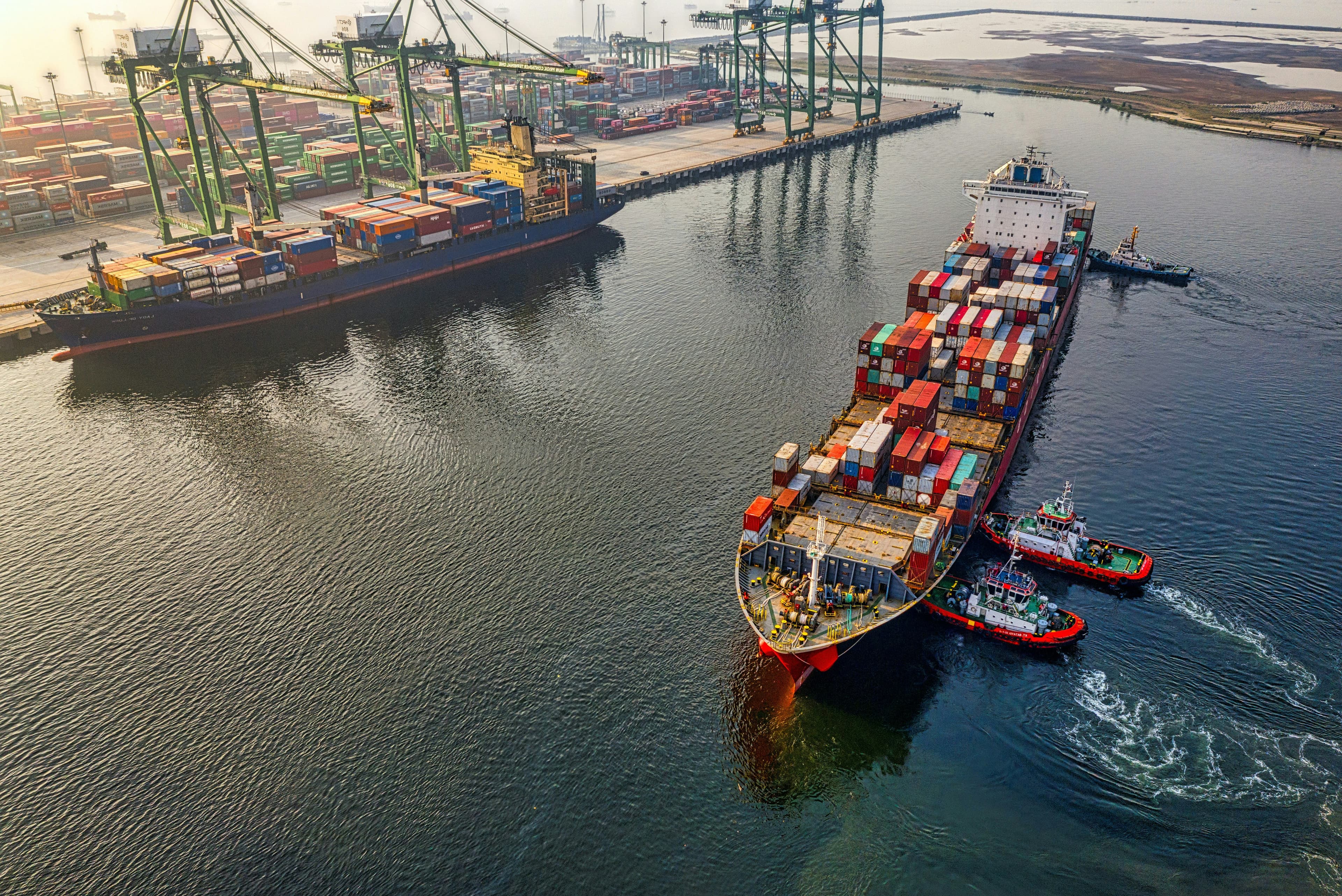 Containers staged at an industrial port  Mabda's supply chain corridor